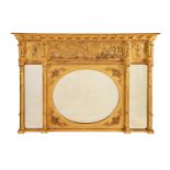 A GILTWOOD AND COMPOSITION OVERMANTEL WALL MIRROR IN REGENCY STYLE