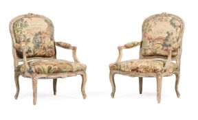 A PAIR OF FRENCH PAINTED AND PARCEL GILT FAUTEUILS