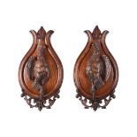 A PAIR OF AUSTRO-GERMAN CARVED OAK WALL PLAQUES OF GAME