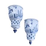 A PAIR OF ENGLISH DELFT BLUE AND WHITE WALL POCKETS