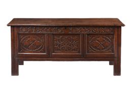 A CARVED OAK COFFER