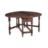 AN OAK GATELEG TABLE