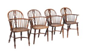 A HARLEQUIN SET OF FOUR 'THAMES VALLEY' COMB BACK ARMCHAIRS