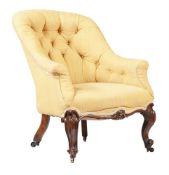 A VICTORIAN MAHOGANY AND BUTTON UPHOLSTERED ARMCHAIR