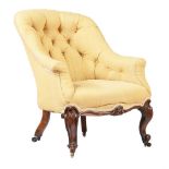 A VICTORIAN MAHOGANY AND BUTTON UPHOLSTERED ARMCHAIR
