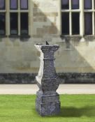 ‡ A FRENCH CARVED LIMESTONE BALUSTER PEDESTAL