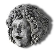 Ω A CARVED LIMESTONE WALL FOUNTAIN MASK