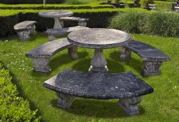 Ω A SUITE OF COMPOSITION STONE GARDEN FURNITURE