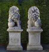 Ω A PAIR OF SCULPTED LIMESTONE MODELS OF LIONS ON PEDESTALS