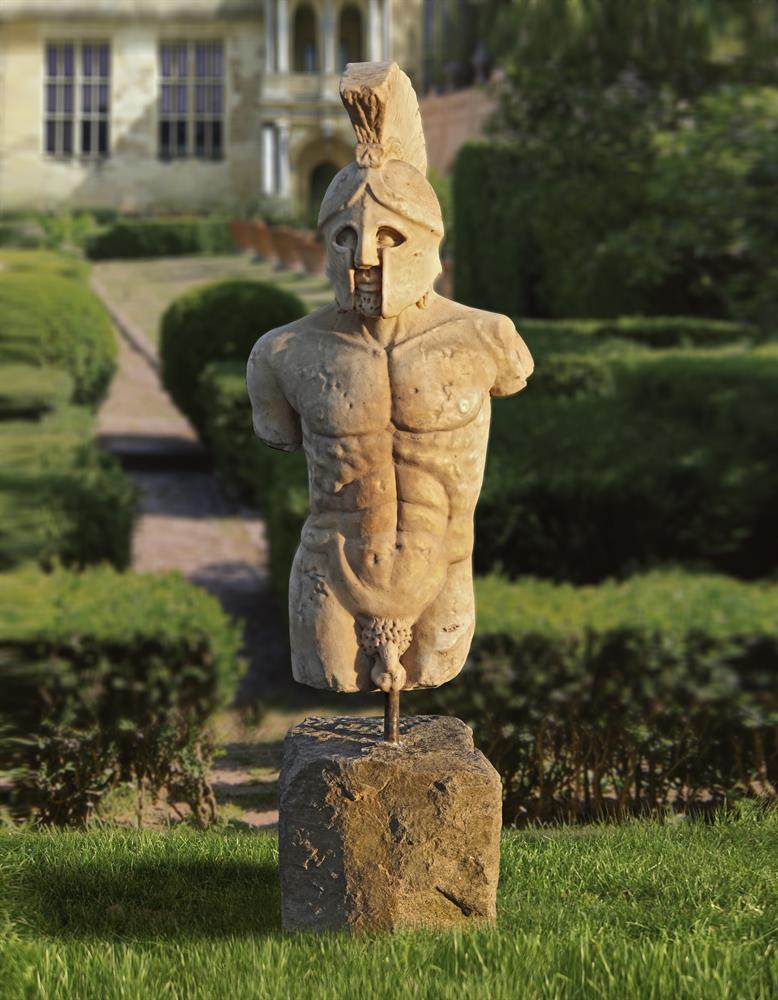 Ω A MODERN SCULPTED MARBLE MODEL OF A TORSO OF A GREEK WARRIOR (SPARTAN)