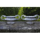 ‡ A PAIR OF ENAMELLED CAST IRON OVAL TWIN HANDLED PLANTERS