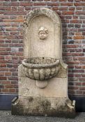 Ω A FRENCH LIMESTONE WALL FOUNTAIN