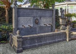 ‡ A MONUMENTAL CARVED BELGIAN BLUE STONE WALL FOUNTAIN
