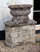 ‡ A FRENCH CARVED LIMESTONE OVAL CISTERN