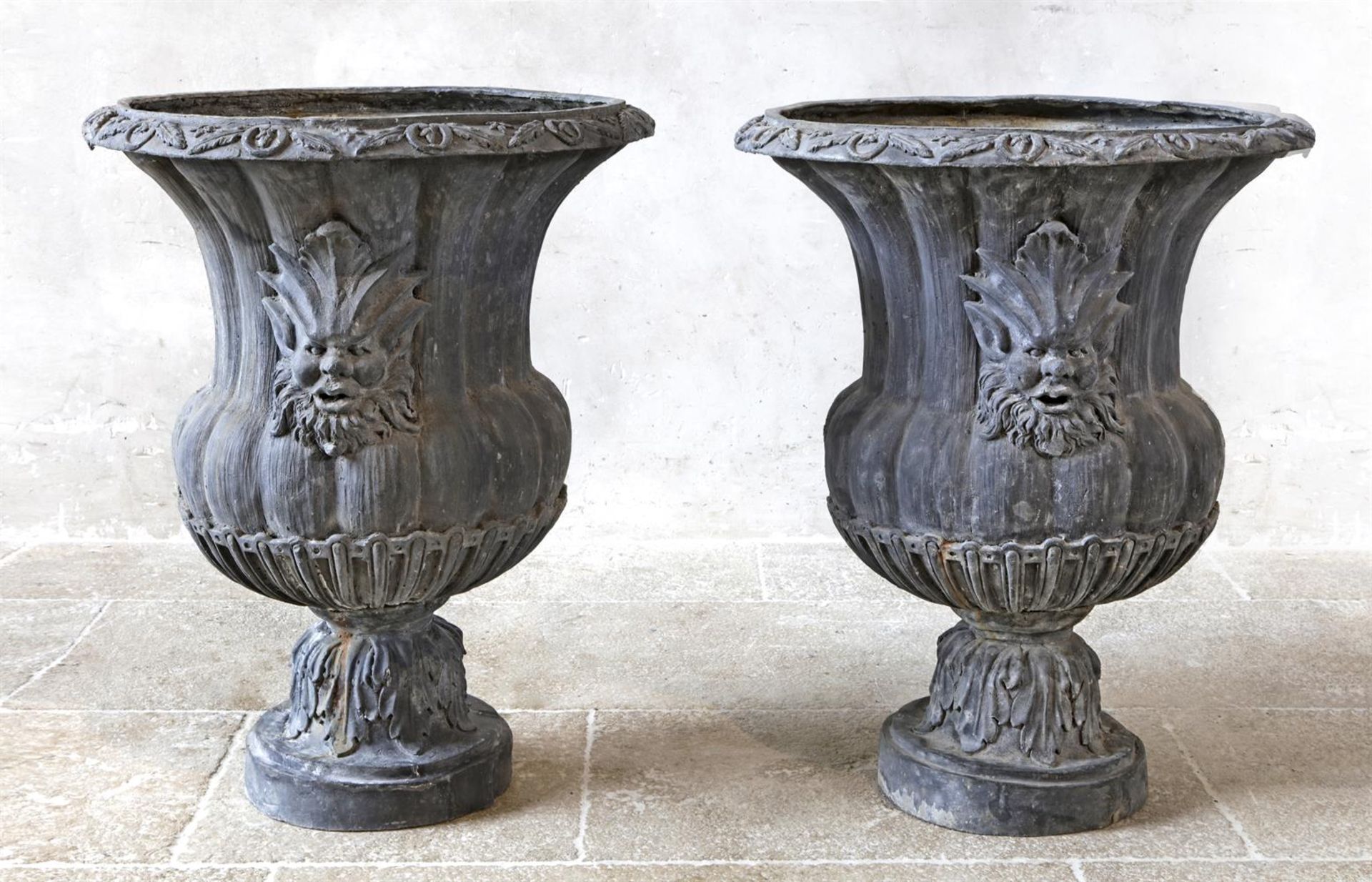 ‡ A PAIR OF LEAD GARDEN URNS