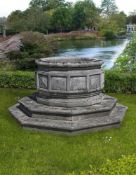 ‡ A LARGE CARVED STONE DODECAGONAL WELLHEAD