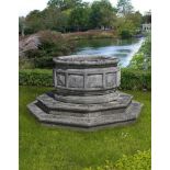 ‡ A LARGE CARVED STONE DODECAGONAL WELLHEAD