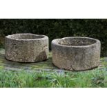 ‡ TWO SIMILAR CIRCULAR CARVED LIMESTONE TROUGHS