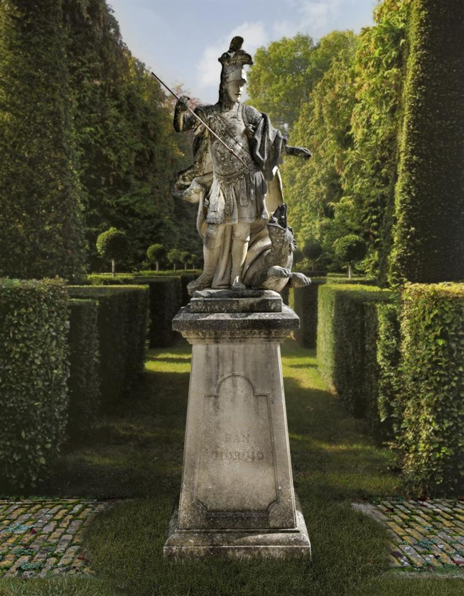 Ω AN ITALIAN SCULPTED LIMESTONE MODEL OF SAINT GEORGE