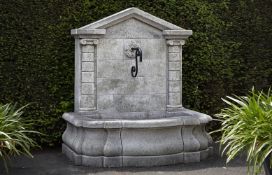 Ω AN ITALIAN CARVED LIMESTONE WALL FOUNTAIN