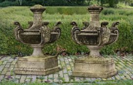 ‡ A PAIR OF LARGE EDWARDIAN CARVED LIMESTONE URN FINIALS