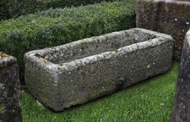 ‡ A CARVED GRITSTONE TROUGH