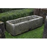 ‡ A CARVED GRITSTONE TROUGH