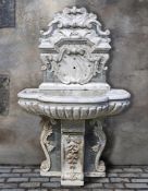 ‡ A CARVED WHITE AND SPECIMEN MARBLE WALL FOUNTAIN