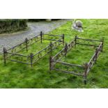 ‡ A PAIR OF WROUGHT IRON FLOWER BED SURROUNDS