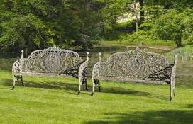 Ω A PAIR OF CONTINENTAL CAST IRON GARDEN BENCHES IN 19TH CENTURY STYLE