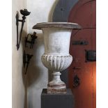 ‡ A LARGE CAST IRON GARDEN URN