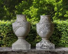 ‡ A PAIR OF FRENCH CARVED LIMESTONE URN FINIALS