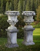 ‡ A PAIR OF SICILIAN CARVED LIMESTONE PLANTERS