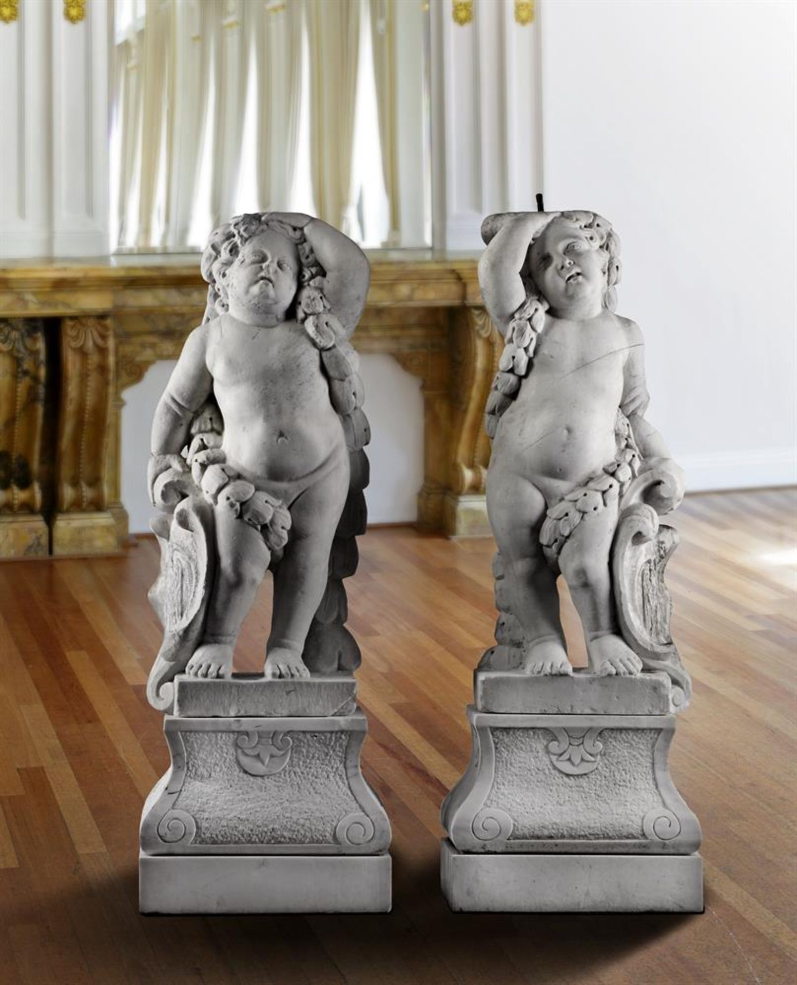 ‡ FOLLOWER OF JAN CLAUDIUS DE COCK, A PAIR OF FLEMISH SCULPTED CARRARA MARBLE MODELS OF PUTTI