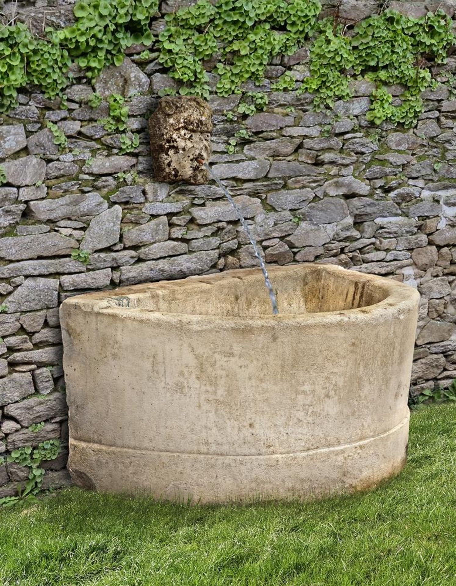 ‡ A FRENCH CARVED PIERRE DE BOURGOGNE LIMESTONE BASIN