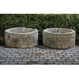 ‡ TWO SIMILAR CIRCULAR CARVED LIMESTONE TROUGHS