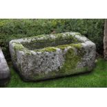 ‡ A CARVED STONE TROUGH