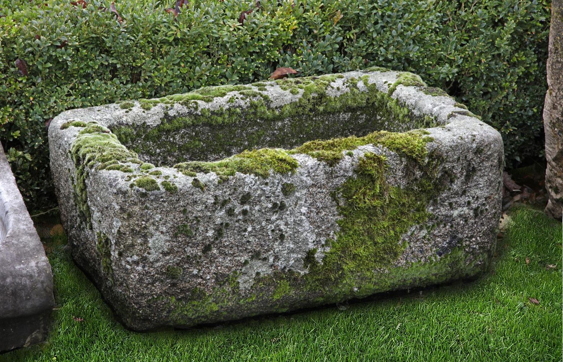 ‡ A CARVED STONE TROUGH