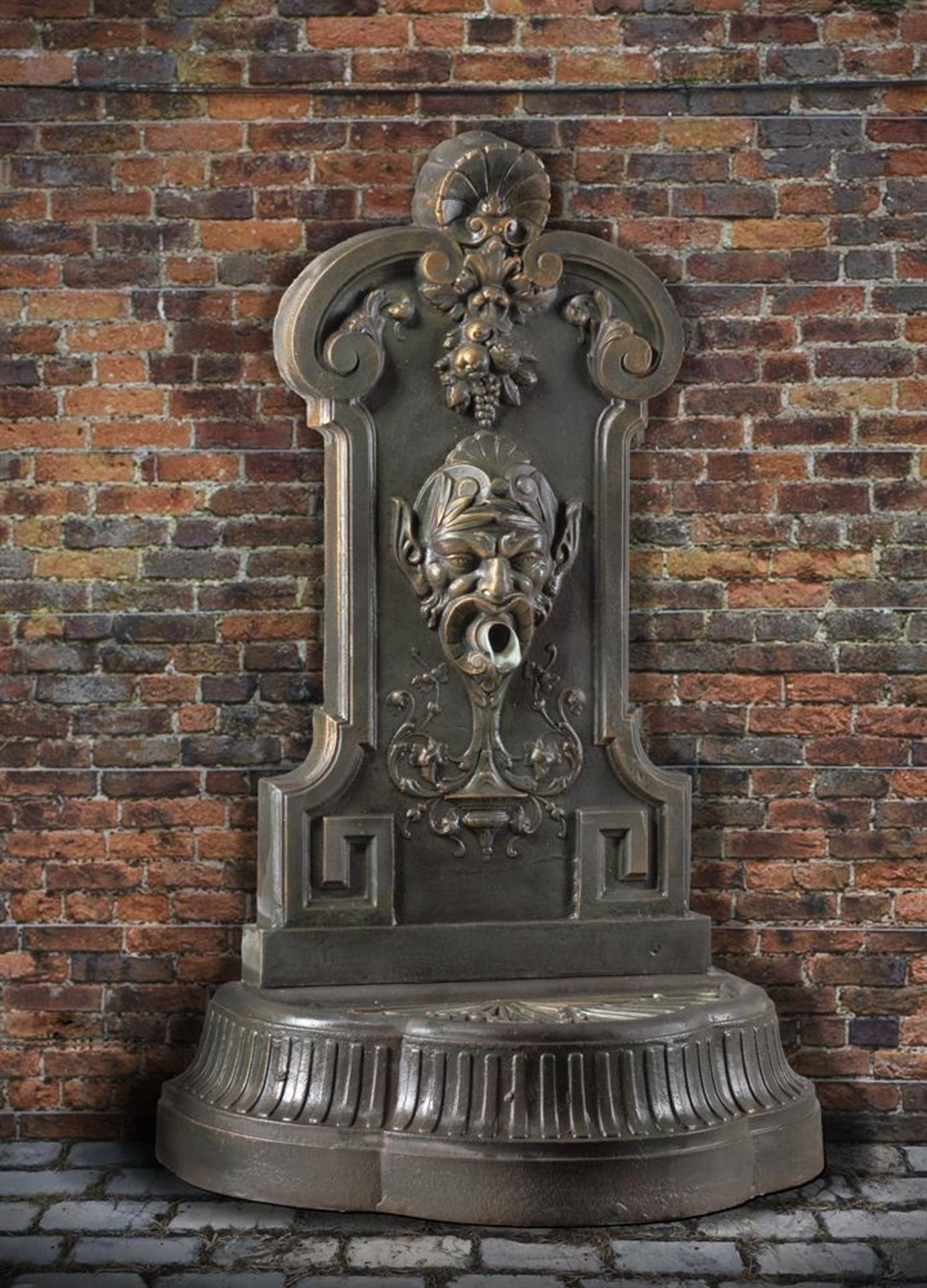 Ω A CONTINENTAL CAST IRON WALL FOUNTAIN