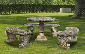 Ω A SUITE OF CARVED LIMESTONE GARDEN FURNITURE