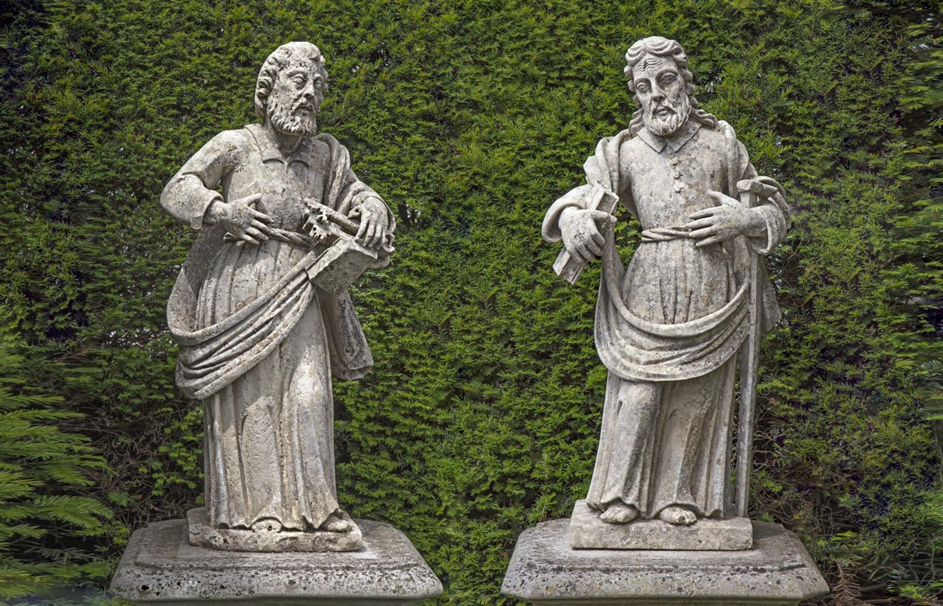 ‡ A PAIR OF SCULPTED LIMESTONE MODELS OF SAINTS PETER AND PAUL