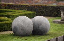 Ω A LARGE PAIR OF LIMESTONE ORNAMENTAL SPHERES