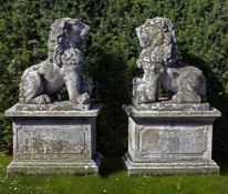 Ω A PAIR OF SCULPTED LIMESTONE MODELS OF LIONS ON PEDESTALS