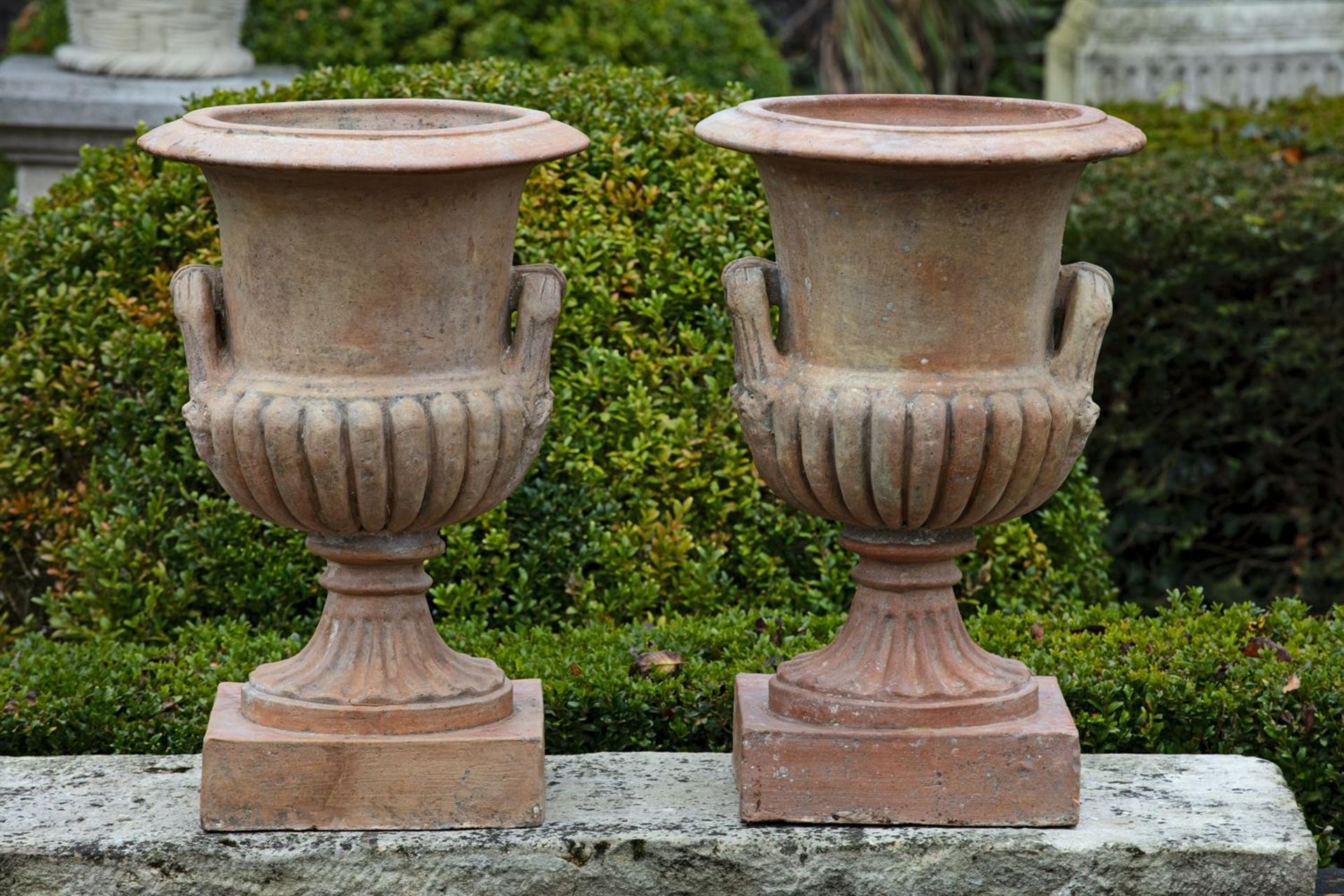 ‡ A PAIR OF TERRACOTTA VASES