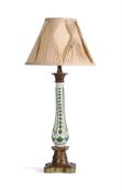 A FRENCH PALE GREEN AND OPAQUE WHITE OVERLAY GLASS AND GILT METAL MOUNTED COLUMNAR PARAFFIN LAMP