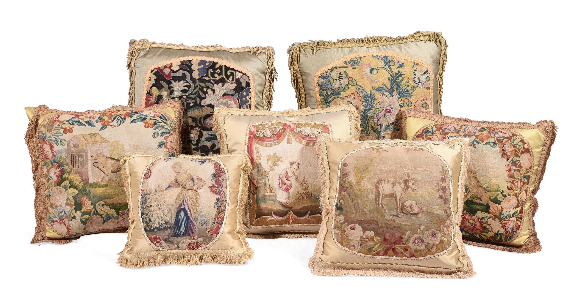 SEVEN LARGE CUSHIONS INCORPORATING 18TH CENTURY WOOLWORK AND LATER FABRIC