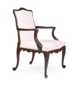 A CARVED MAHOGANY AND UPHOLSTERED OPEN ARMCHAIR IN GEORGE III STYLE, 19TH CENTURY