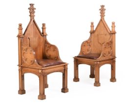A PAIR OF CARVED OAK THRONE CHAIRSIN GOTHIC REVIVAL TASTE, LATE 19TH/ EARLY 20TH CENTURY