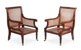 A PAIR OF MAHOGANY AND CANED LIBRARY ARMCHAIRS IN REGENCY STYLE, 20TH CENTURY