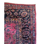 A LARGE CENTRAL PERSIAN CARPET